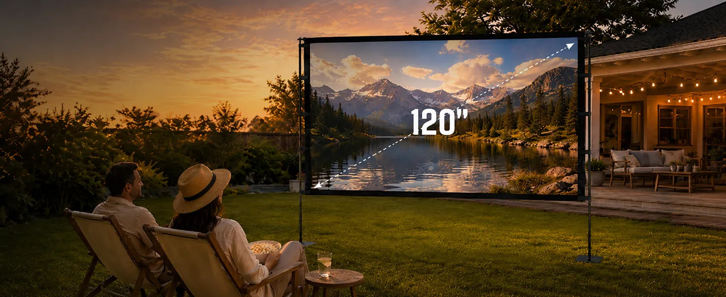 Couple watching a sunset landscape on a STWUI 120-inch outdoor projector screen in a backyard at dusk