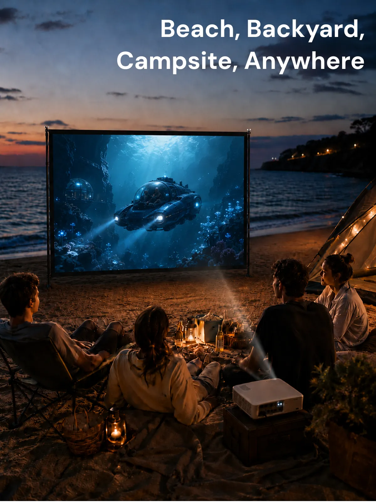 Group watching a movie on an STWUI projector screen on the beach at sunset