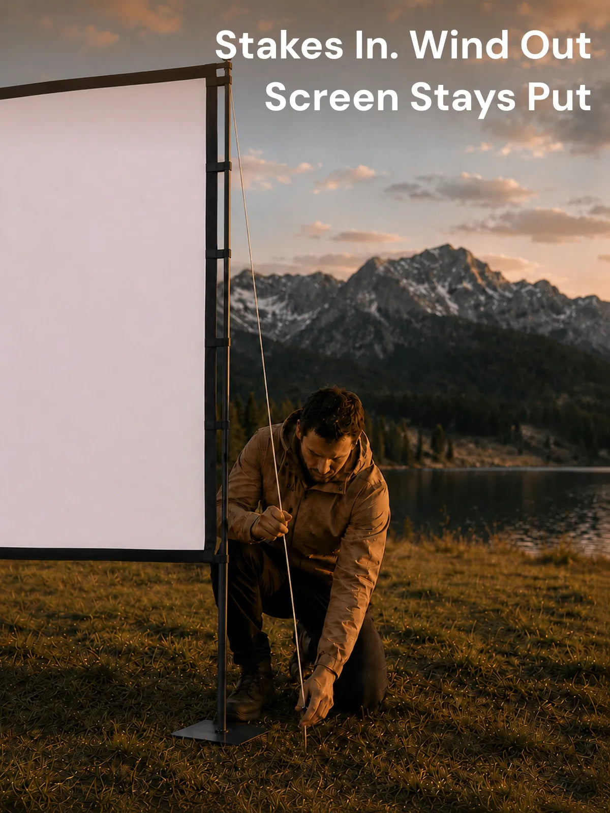 Camper anchoring the STWUI projector screen stand with ground stakes and wind ropes